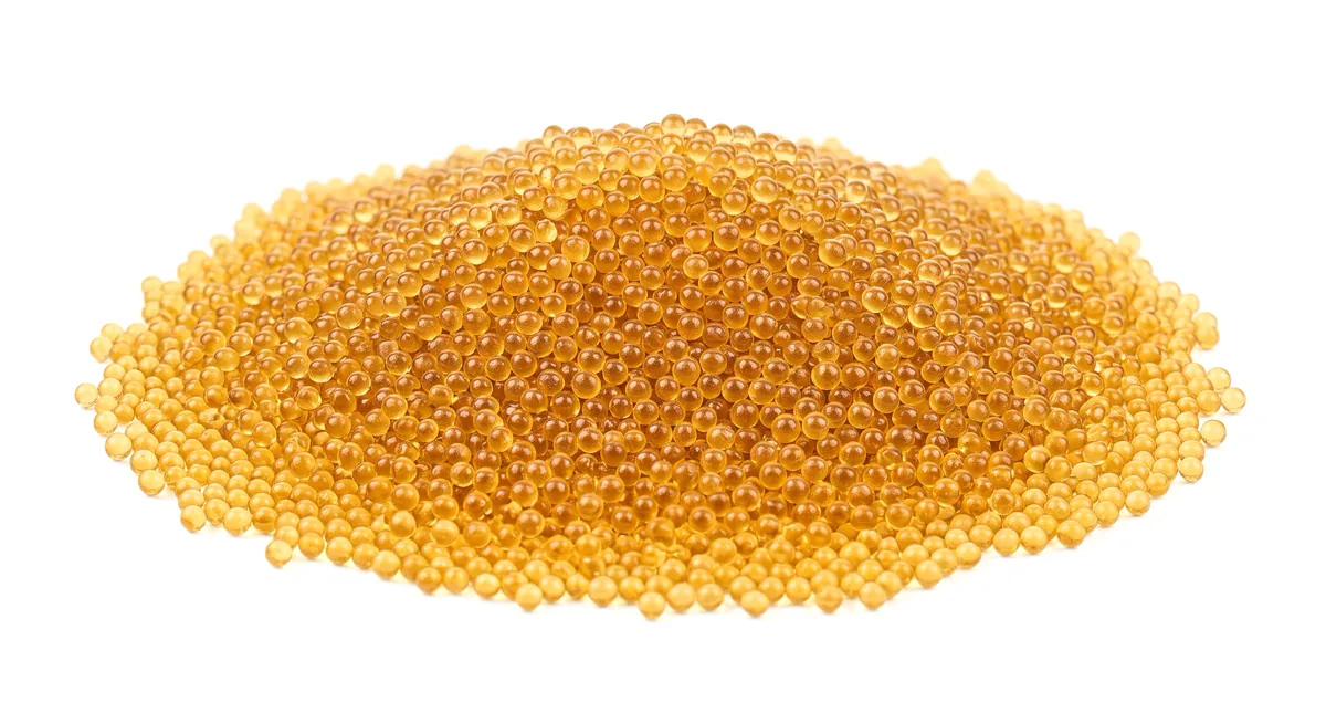Strong acid cation exchange resin beads used in a boiler feedwater softener